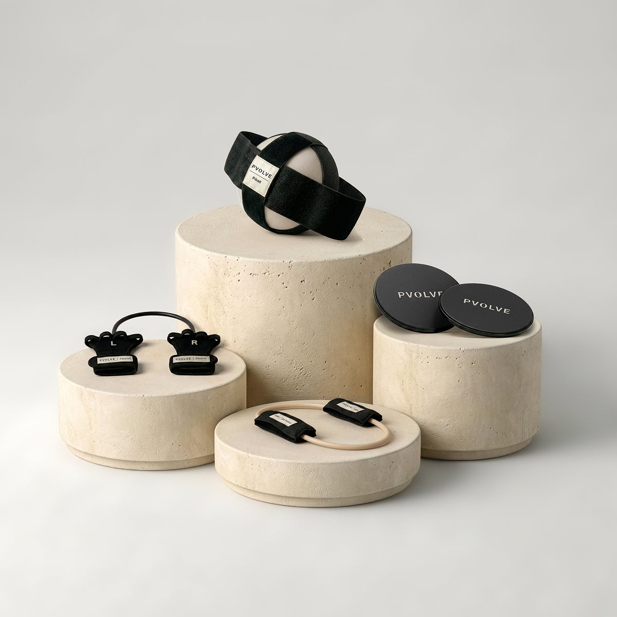 P.volve fitness equipment set with P.ball, P.band, Precision Mat, and tablet showing membership.