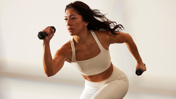 Dani Coleman with light hand weights | P.volve