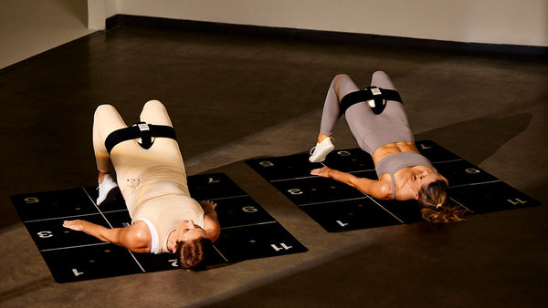 Trainers in Hip Bridge with P.ball | Pvolve