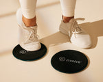 Gliders with trainer standing with one foot atop one glider thumbnail