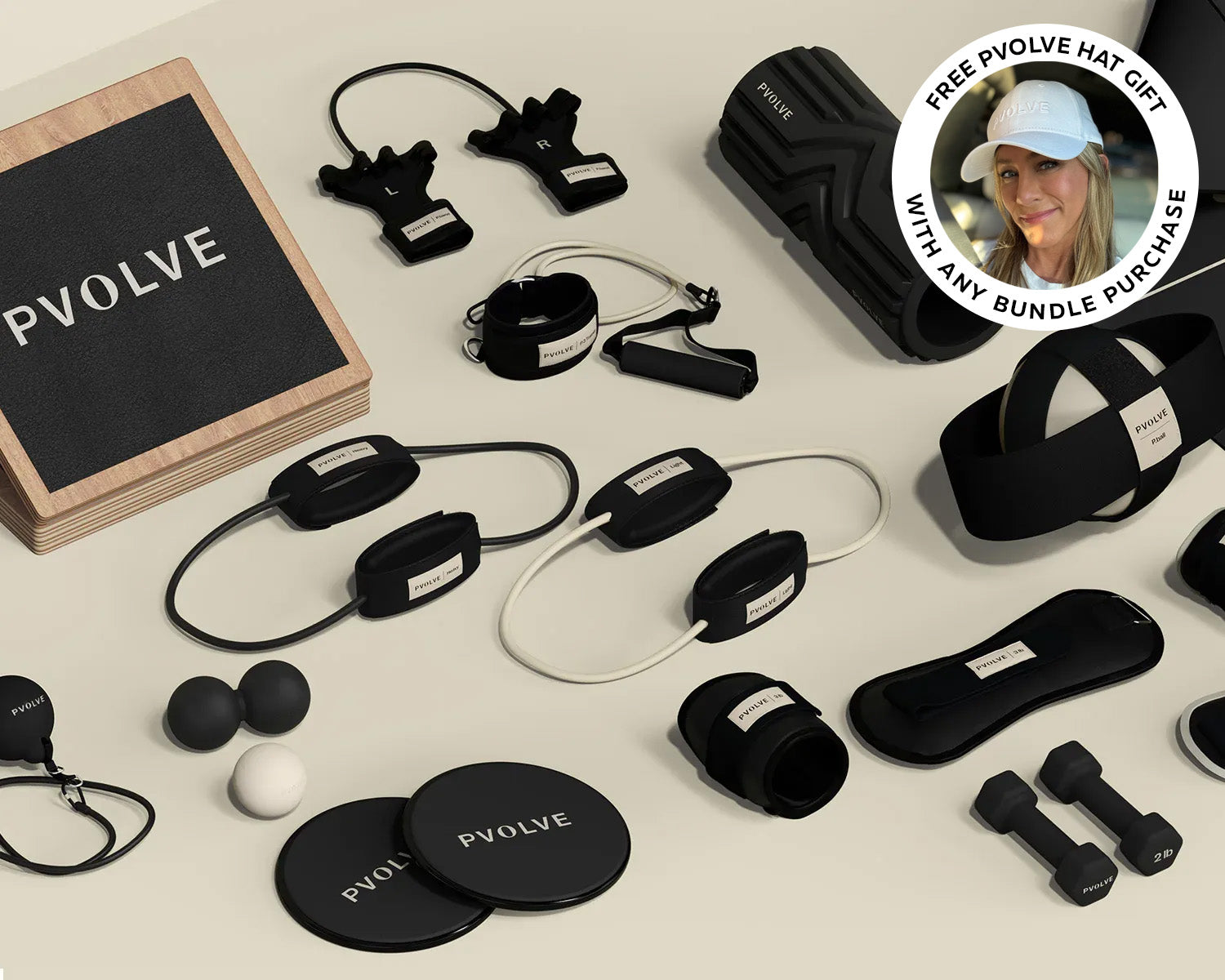 Collection of P.volve fitness equipment including weights, resistance bands, and exercise accessories.